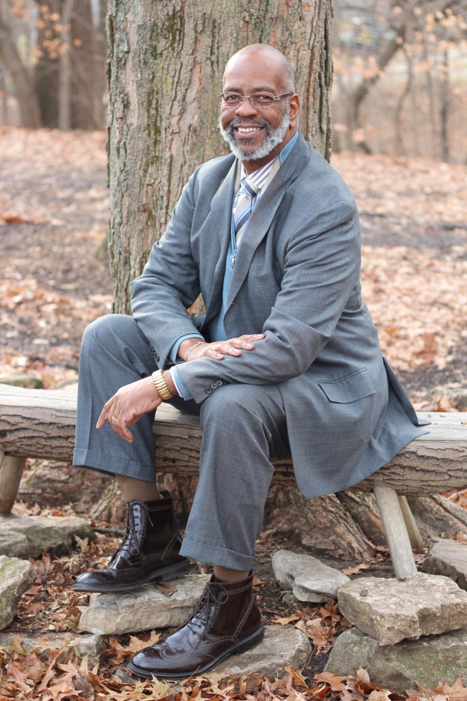 James Garrett Jr. Executive director Indiana Commission on the Social Status of Black Males Layering isn’t just for putting random pieces of clothing together. You can still get a layered effect with a standard suit. (Suit, Polo Ralph Lauren; shirt, Aster; sweater, Cornellani; tie, Tino Cojura; boots, Stafford wingtips) - stylist’s private collection