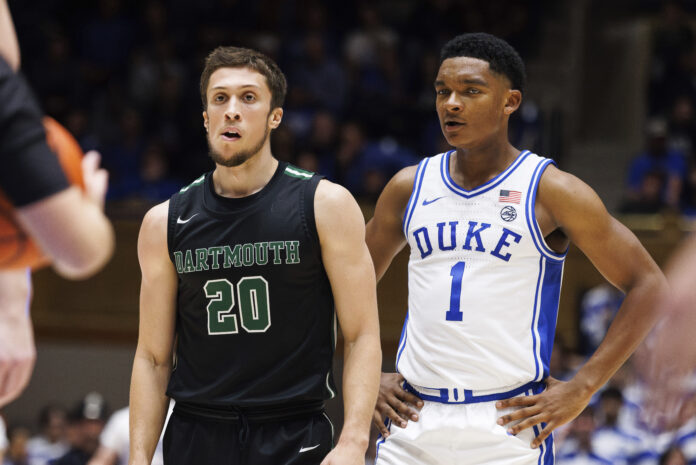 Dartmouth's Romeo Myrthil (20) stands next to Duke's Caleb Foster (1) during the second half of an NCAA college basketball game in Durham, N.C., Monday, Nov. 6, 2023. The Dartmouth men's basketball team voted to unionize Tuesday, March 5, 2024, in an unprecedented step toward forming the first labor union for college athletes and another blow to the NCAA's deteriorating amateur business model. (AP Photo/Ben McKeown)