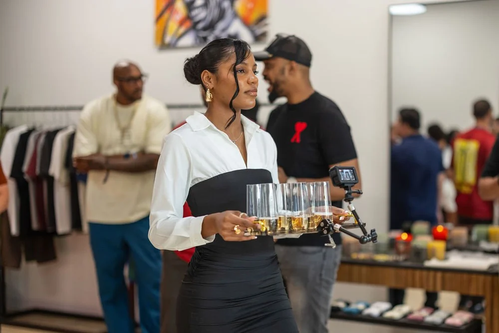 A bartender serving drinks at an event.