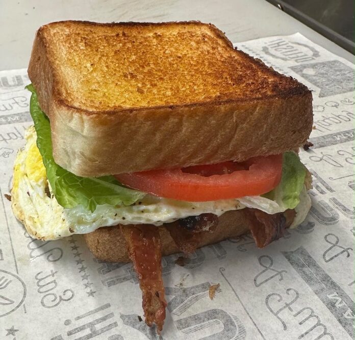 Micah's BLT,BLT topped with ham, a fried egg & Eve's sauce on a pretzel bun (Photo/Eva's Garden Deli website photo)